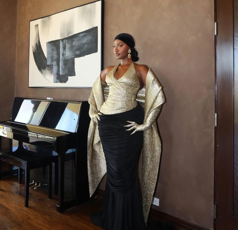 Tems holding her Grammy Award for Best African Music Performance, celebrating her second win