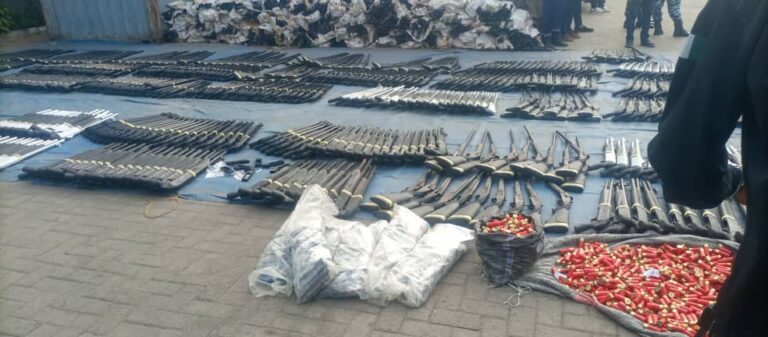 Nigeria Customs officials displaying seized arms and ammunition