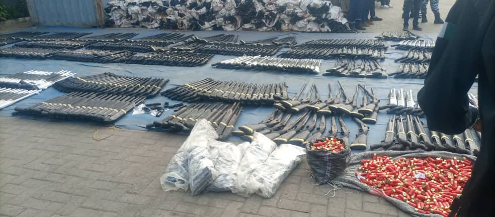 Nigeria Customs officials displaying seized arms and ammunition