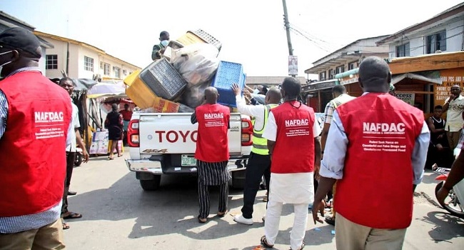 NAFDAC officials inspecting boxes of seized expired drugs in Abia State.