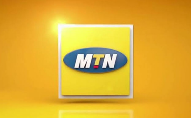 Nigerians protest the MTN Data Tariff Increase, holding signs and expressing their frustration.