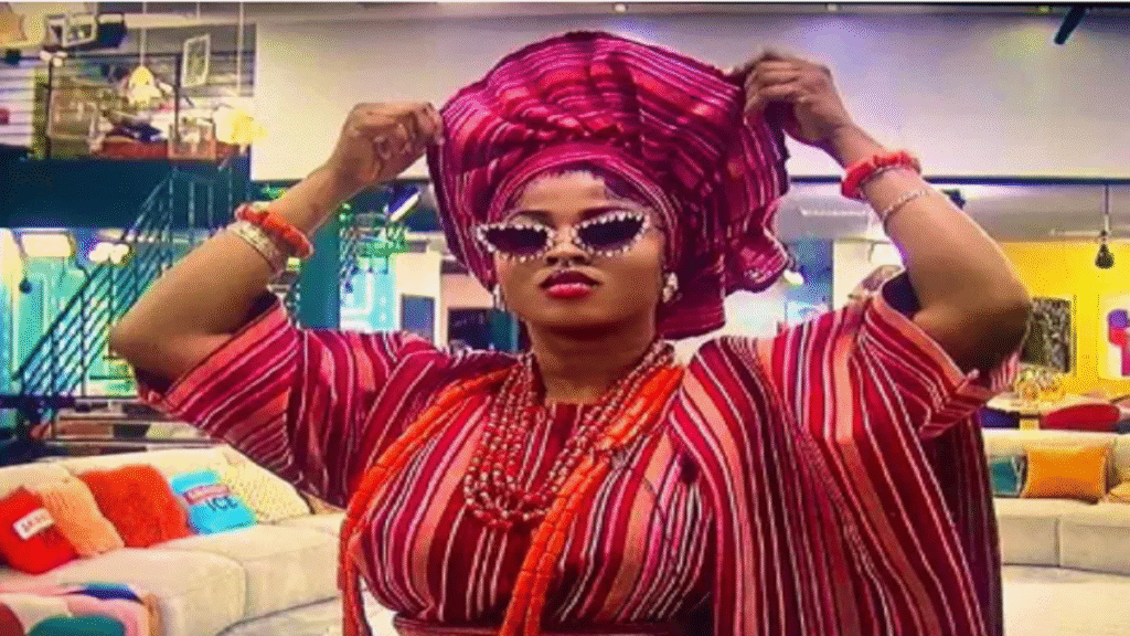 Imisi wins BBNaija Season 10 holding trophy and celebrating with confetti after host Ebuka Obi-Uchendu announces her as winner of N150 million grand prize at Lagos finale